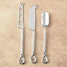 Stainless steel cheese tools for serving and slicing.